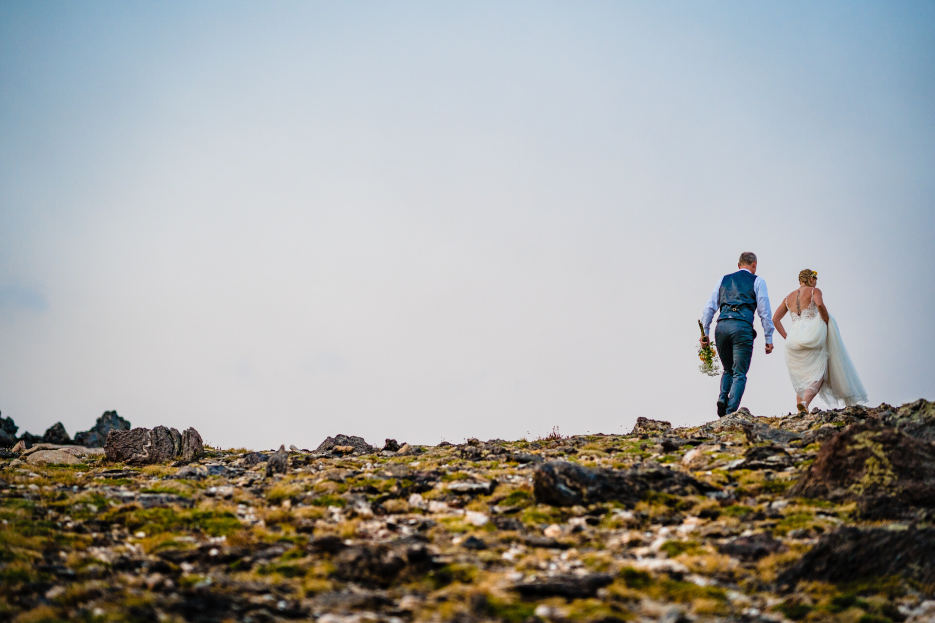 colorado elopement photographer captures couple walking in RMNP after their wedding ceremony in Estes Park, Colorado