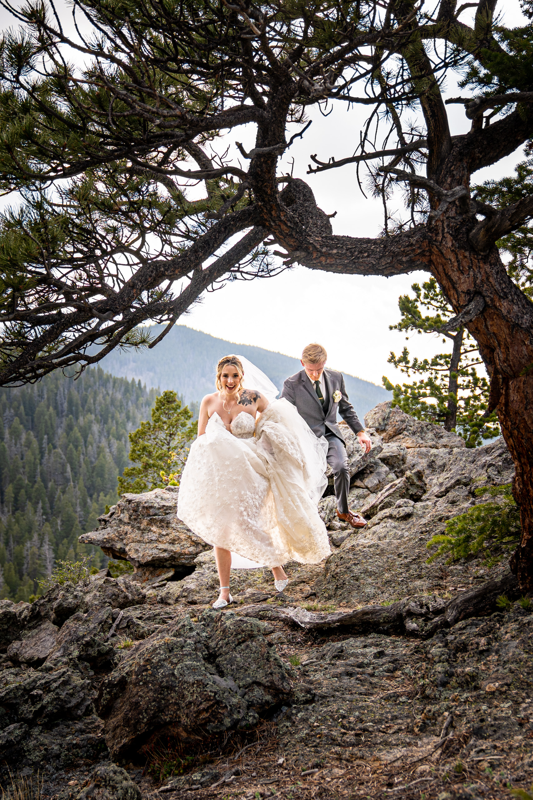 bride and groom on adventure in rocky mountain national park after their wedding