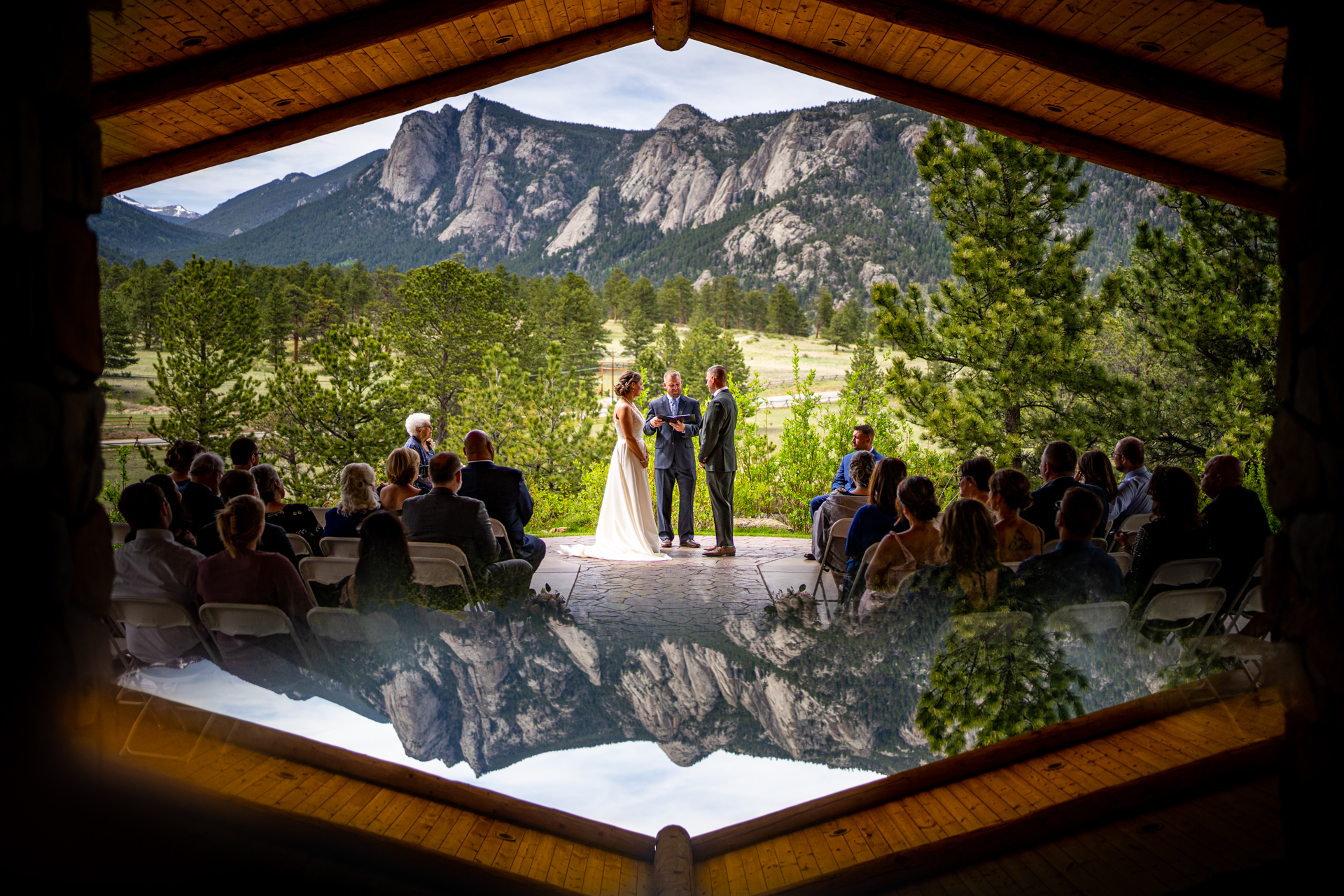 wedding at the black canyon inn with rocky mountain national park in the background