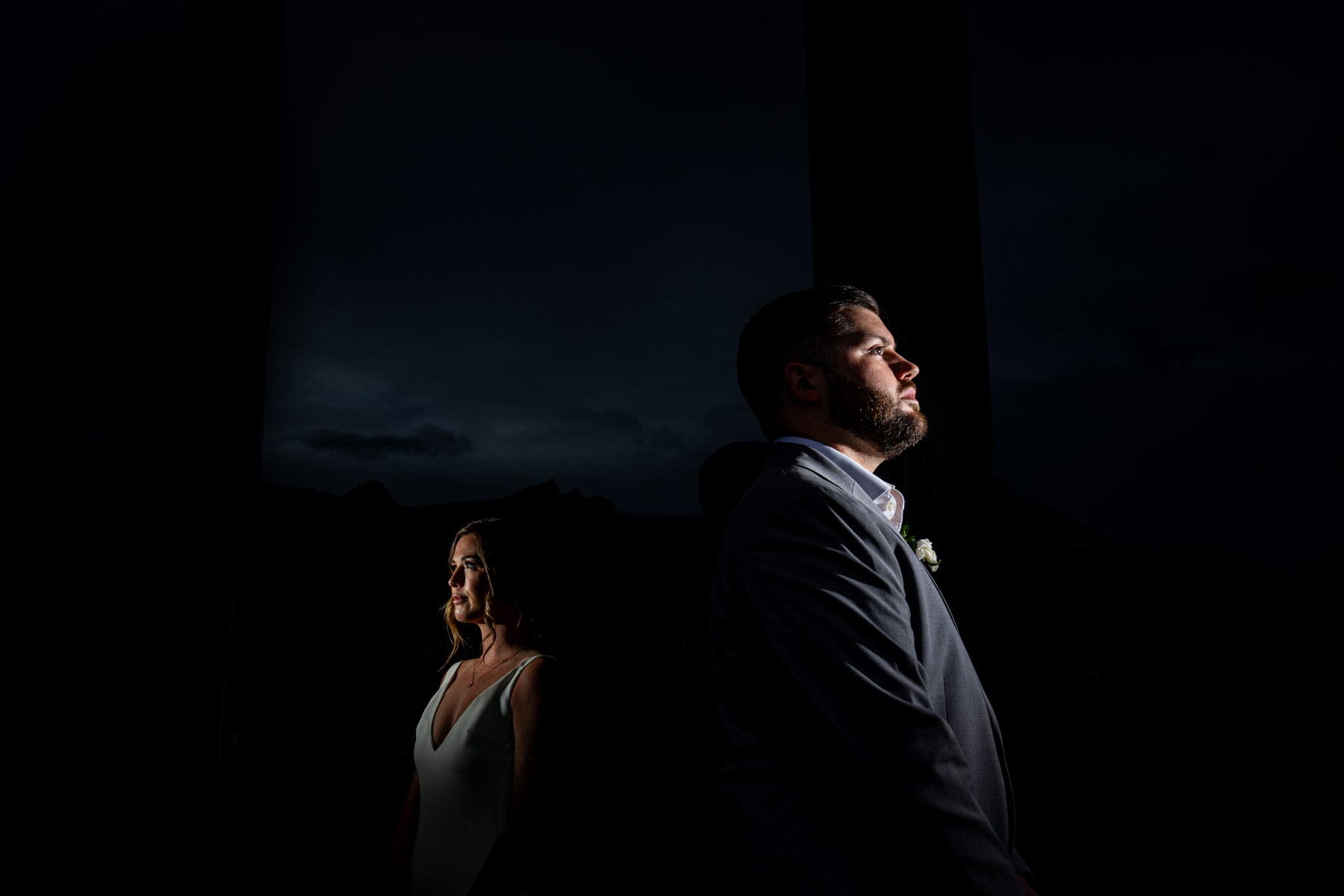 creative reflection image of a bride and groom on their wedding day in estes park, colorado