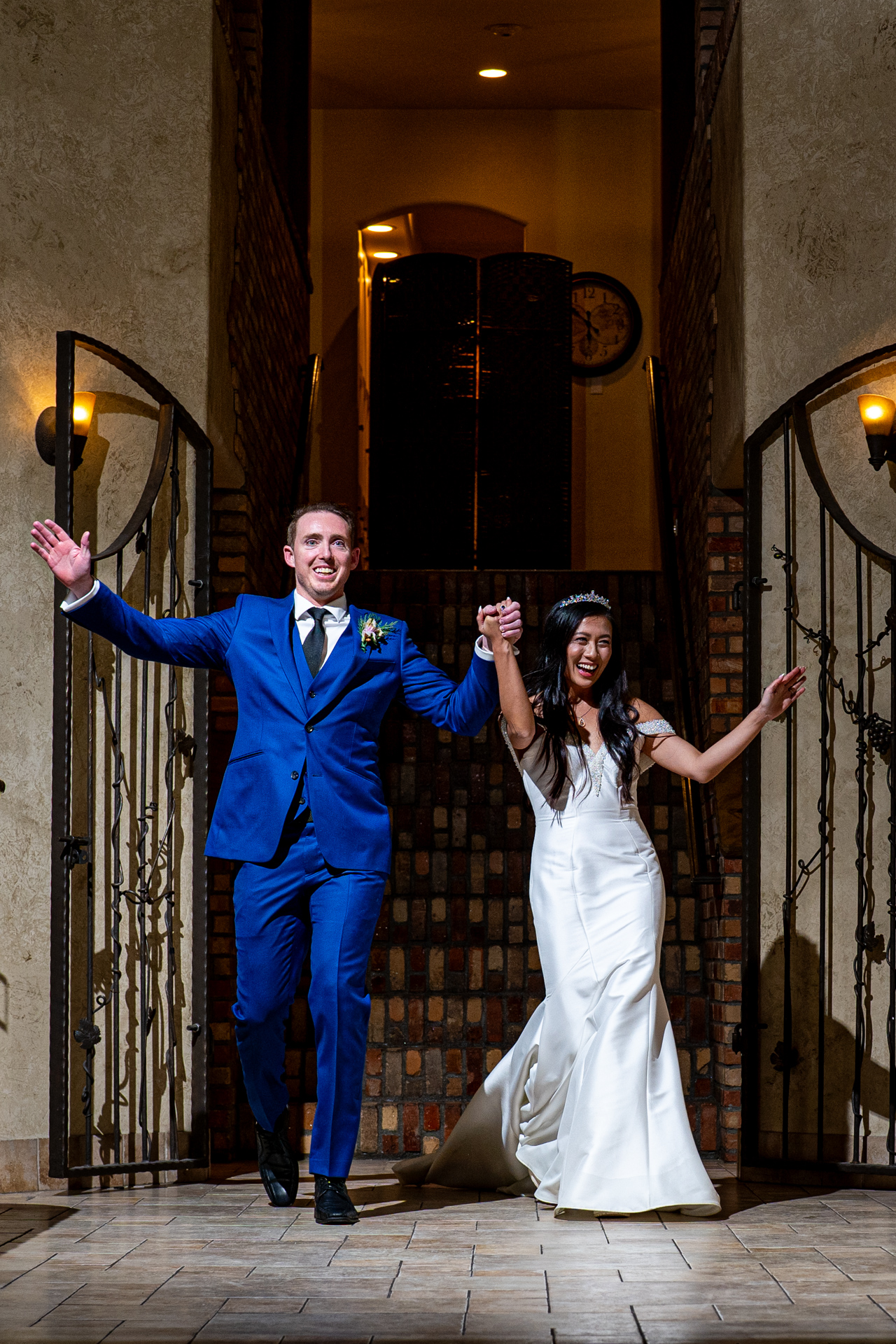 newlyweds celebrating a grand entrance at the della terra mountain chateau, estes park, colorado