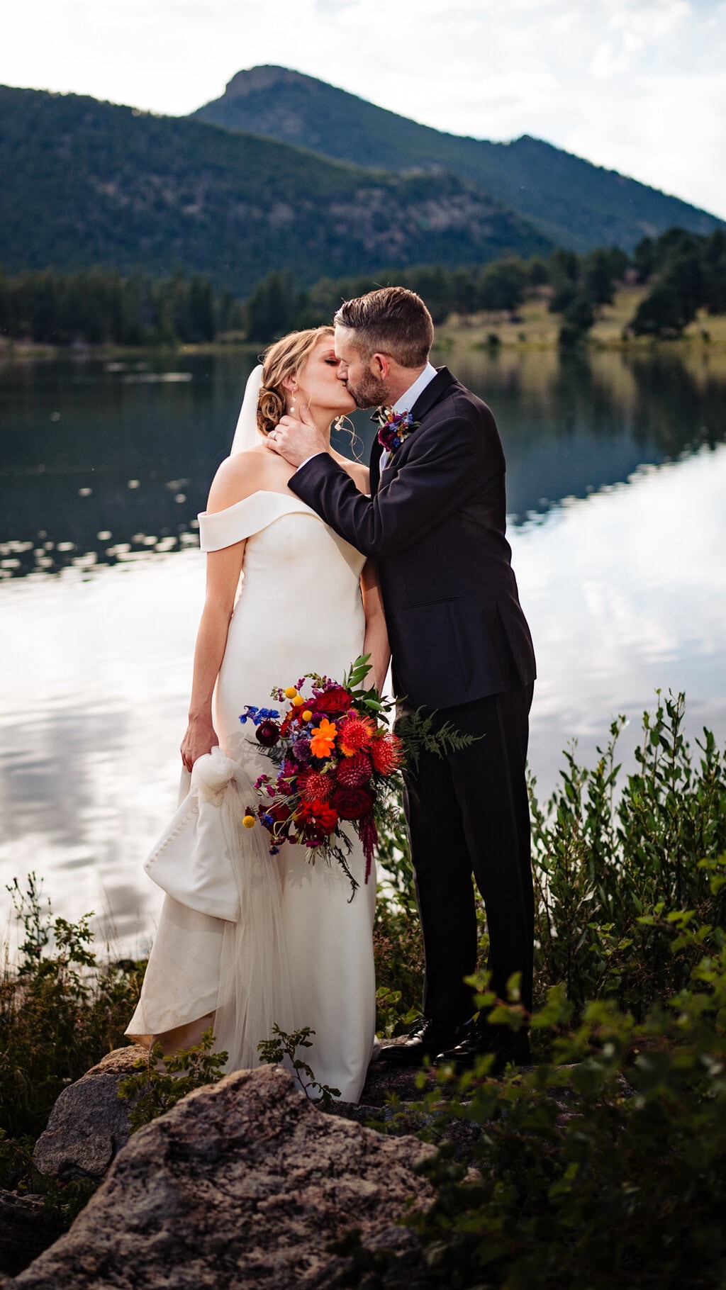 adventure elopement in RMNP couple kissing at lily lake, rmnp, photographed by estes park wedding photographer