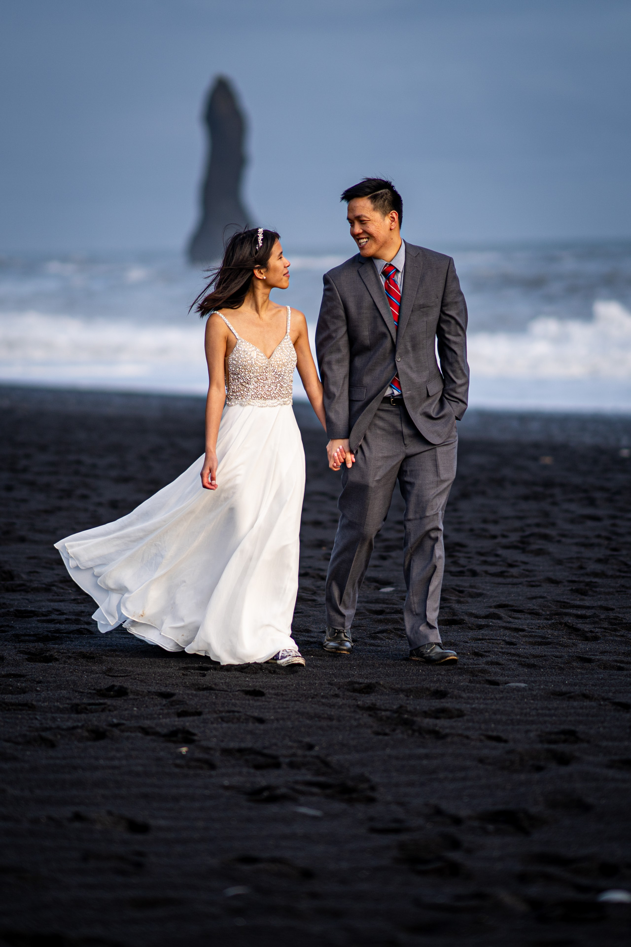 destination elopement photographer captures couple on Black Sand Beach at Vik, Iceland