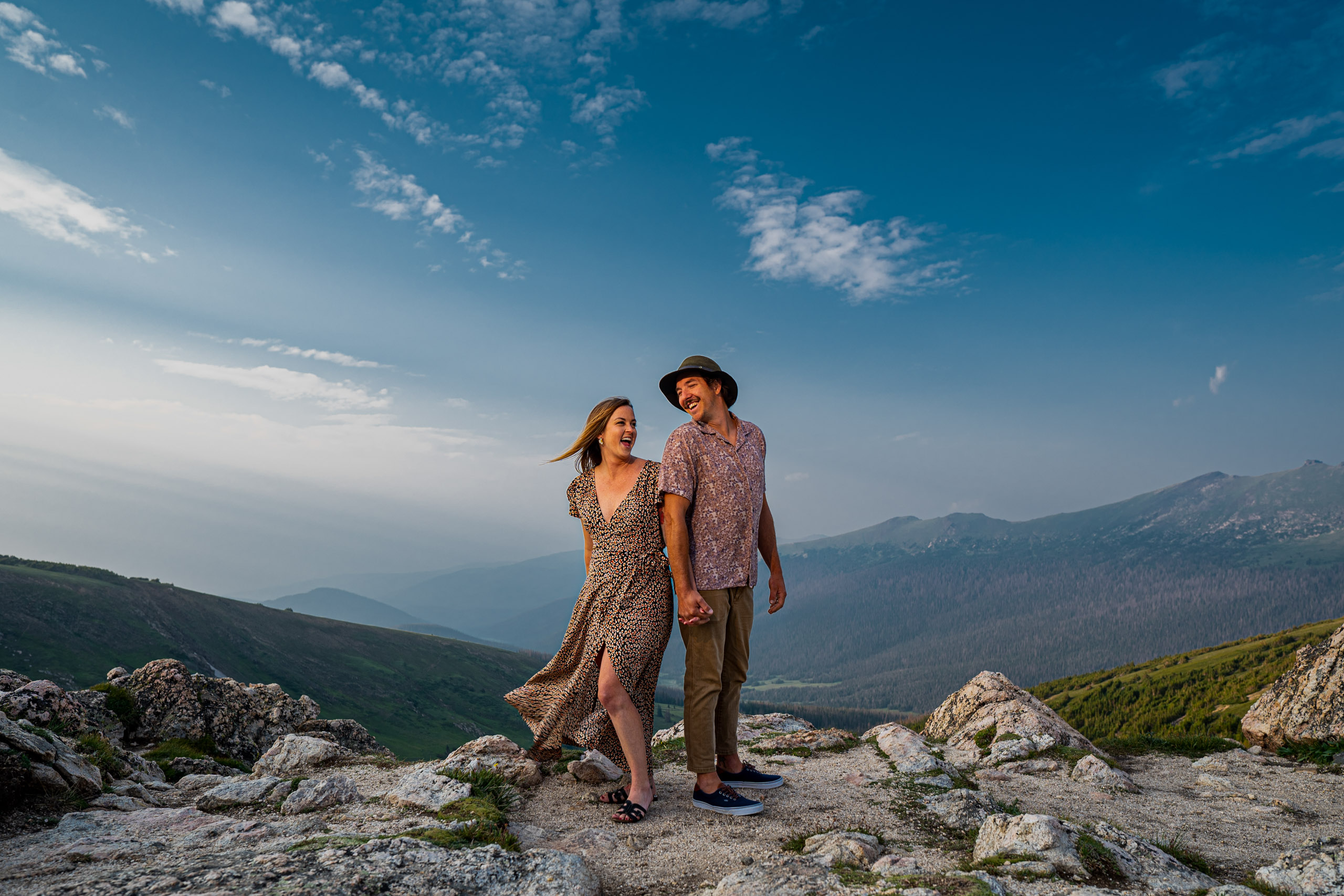 marmot point engagement photo engaged couple shares a laugh captured by estes park engagement photographer