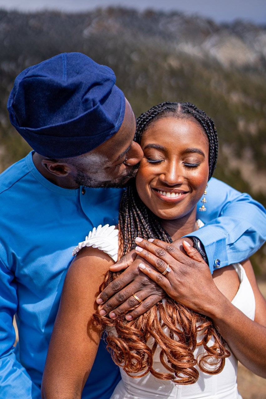 wedding photo in estes park, colorado black couple embraces during a photoshoot by estes park wedding photographer team