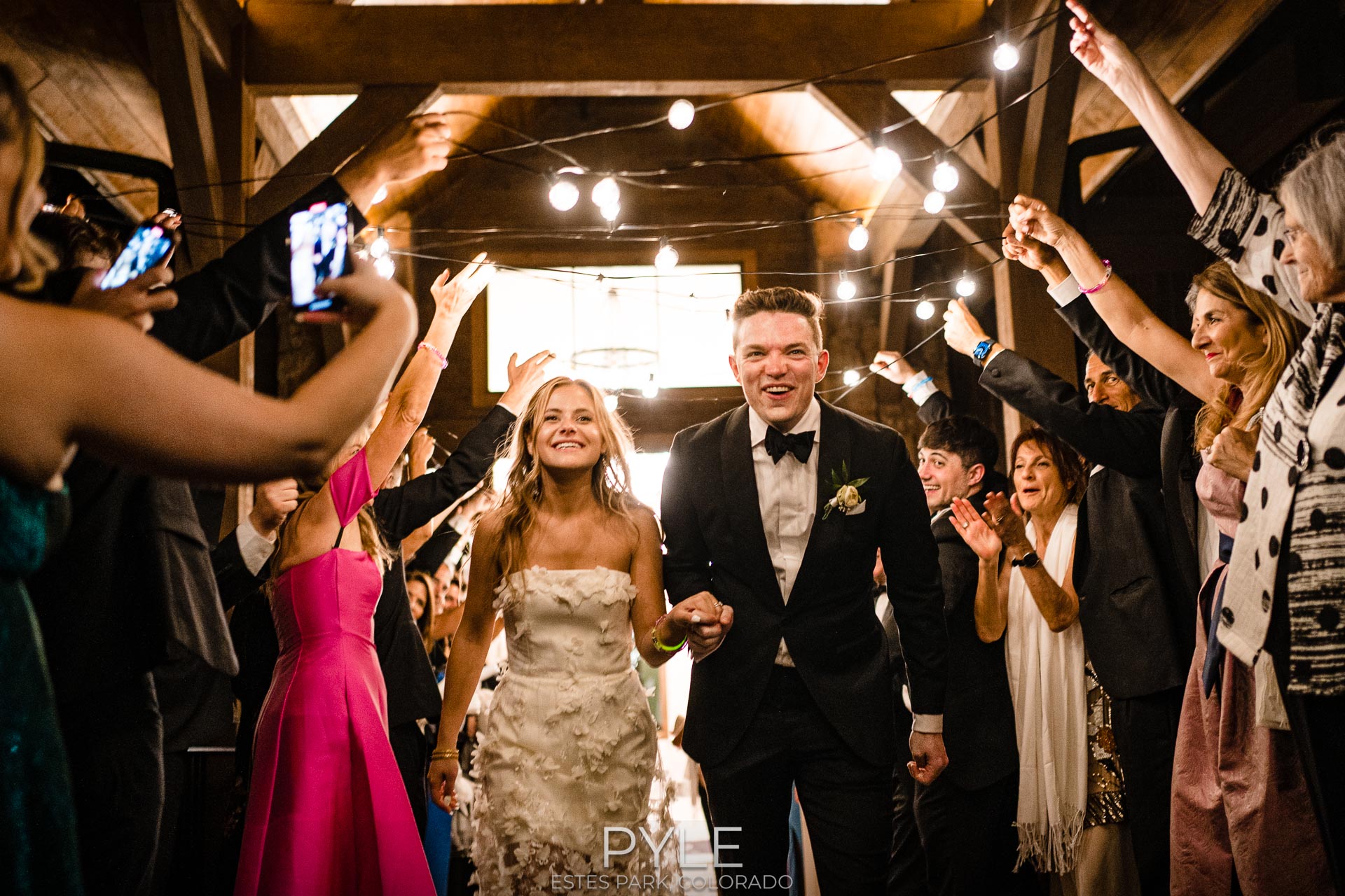 Grand exit from their reception at The Boulders at Black Canyon Inn, Estes Park, Colorado
