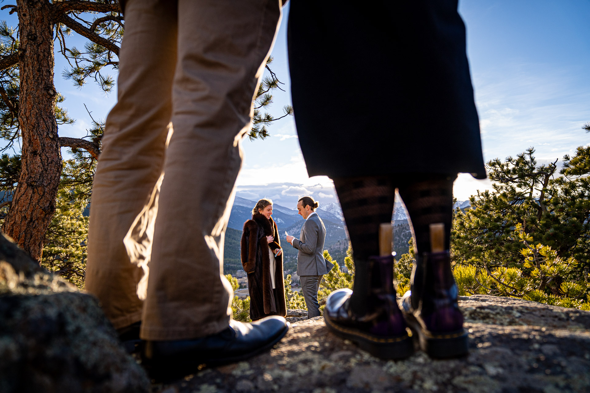 Colorado Elopement Photographer in Estes Park creatively captures couple saying vows