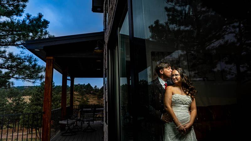Estes Park wedding photographer captures couple inside during a rainstorm on their wedding day