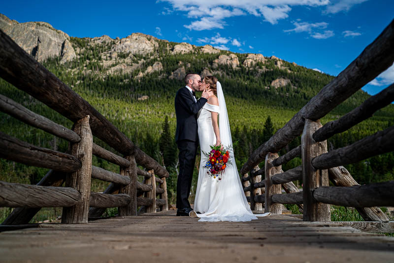 Newly wed couple at Lily Lake, RMNP, by local Estes Park elopement photographer