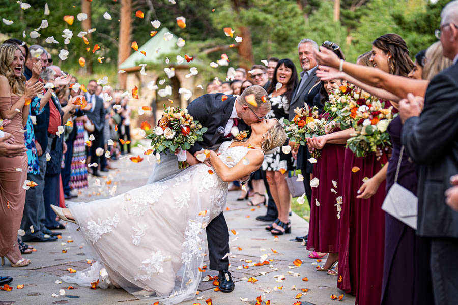Estes Park wedding photographer, Joe Pyle Photography, captures couple during their grand exit