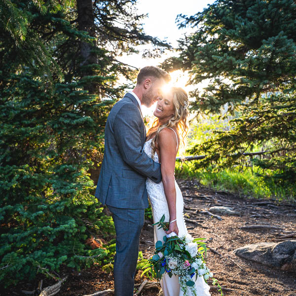 Beautiful couple embracing on their wedding day, photo by Estes Park wedding photographer
