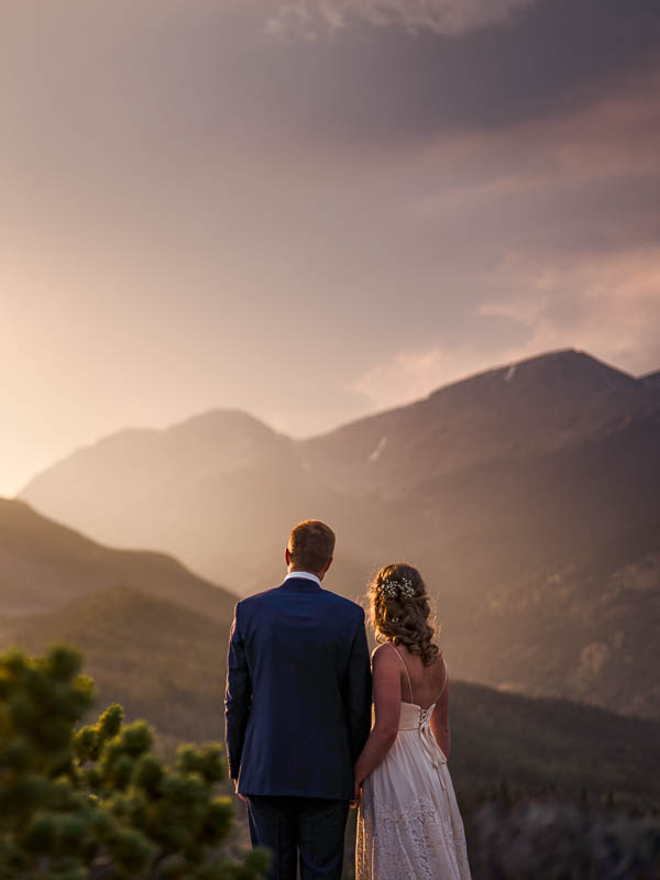 Beautiful photo of a newly married couple at sunset in Rocky Mountain National Park, by Estes Park wedding photographer, Pyle Photography